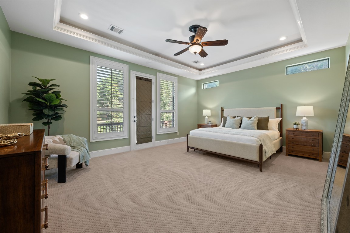 3507 Bachelor Gulch Leander, TX 78641 - Photo 16 of 38 a spacious bedroom with a bed and a chandelier