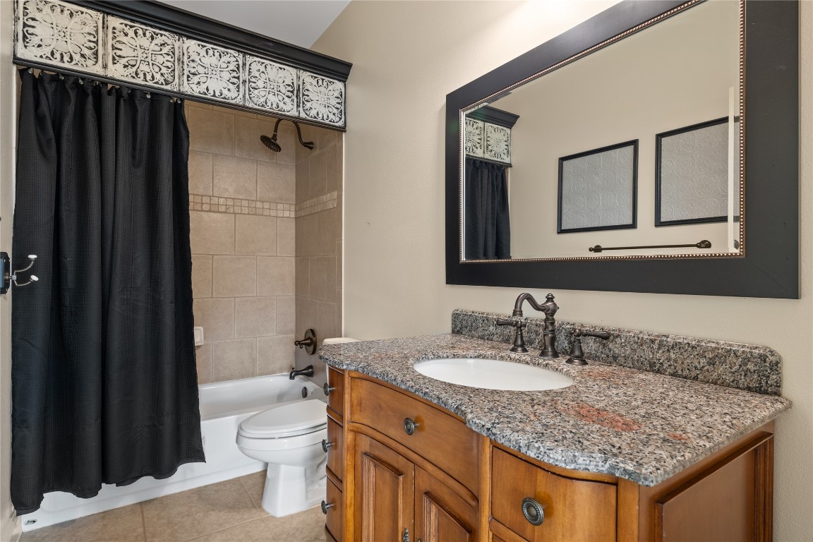 3507 Bachelor Gulch Leander, TX 78641 - Photo 23 of 38 a bathroom with a granite countertop sink toilet and shower