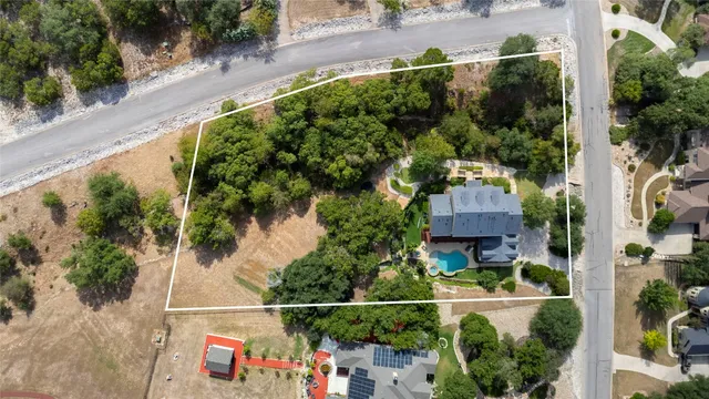 an aerial view of houses with yard