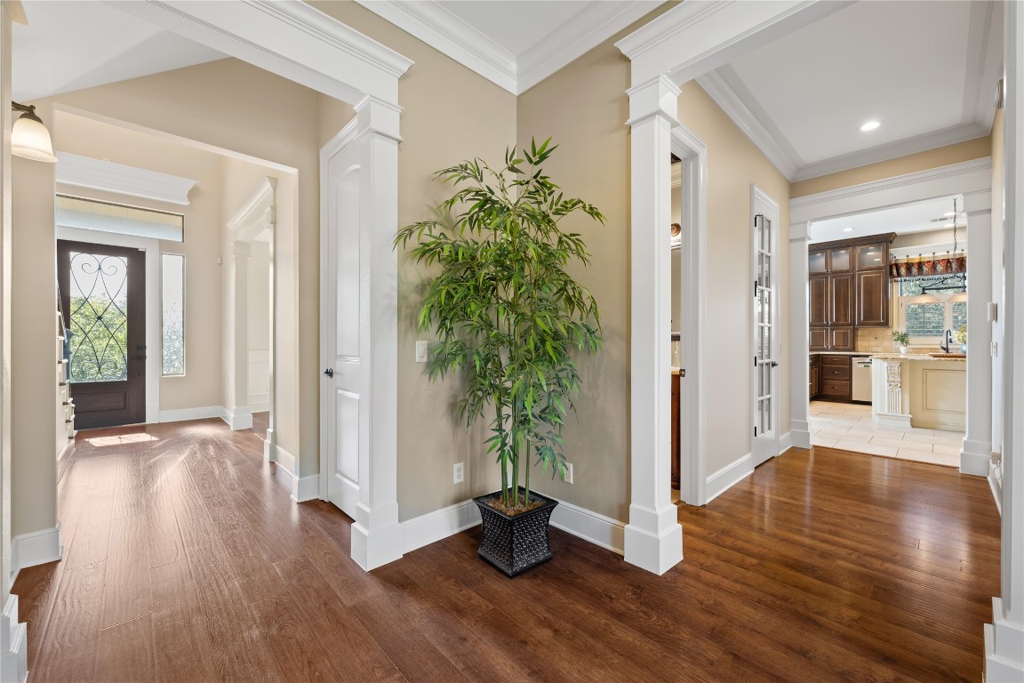 3507 Bachelor Gulch Leander, TX 78641 - Photo 9 of 38 a view of a hallway with wooden floor and a dining room