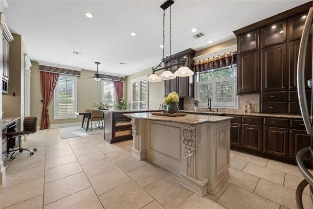 a kitchen with stainless steel appliances granite countertop a sink and cabinets