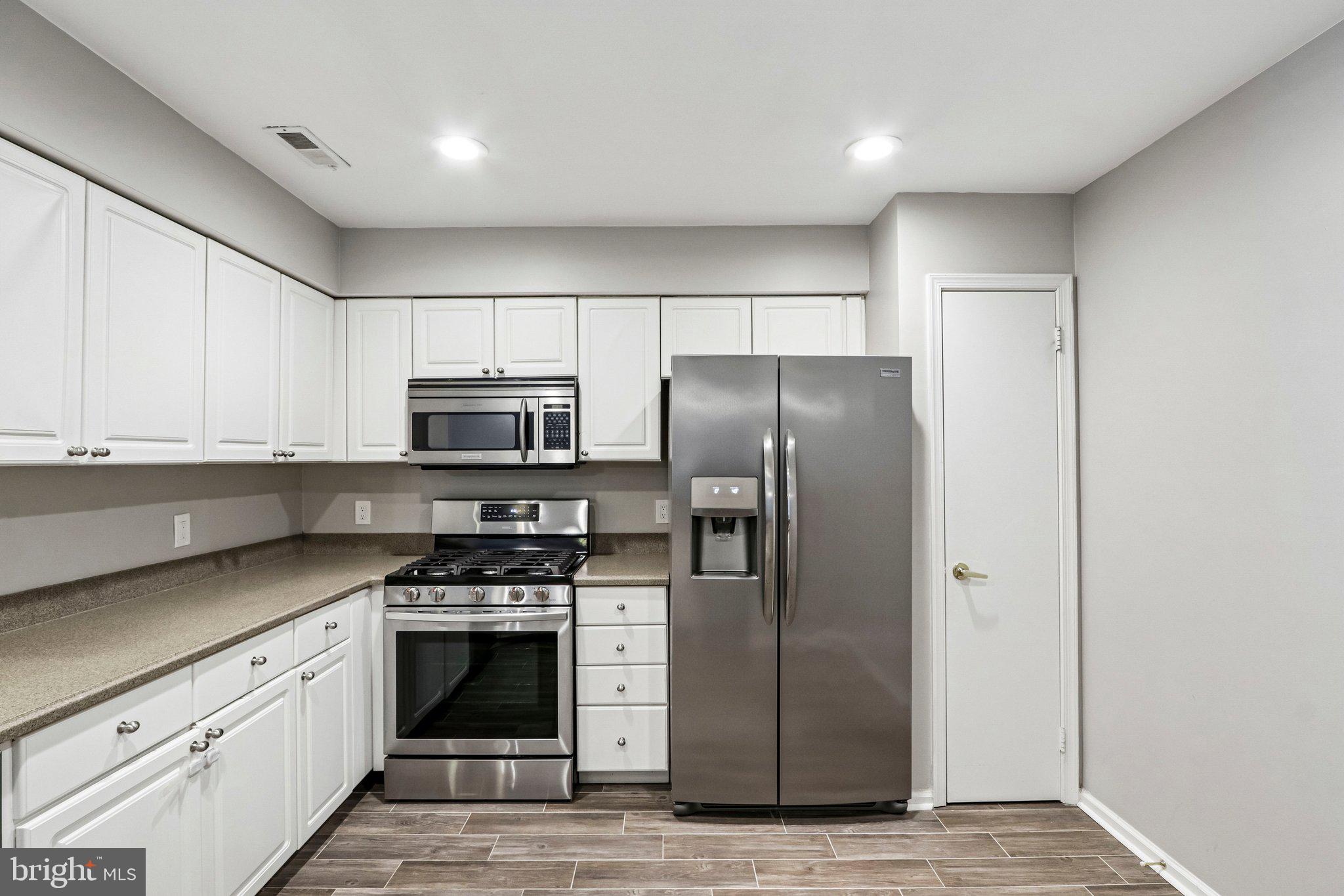 803 Wharton Road Mount Laurel, NJ 08054 - Photo 5 of 48 a kitchen with stainless steel appliances a refrigerator stove and microwave