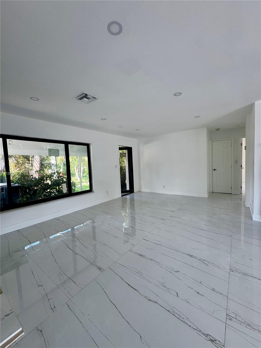 3030 Arthur Street Hollywood, FL 33021 - Photo 4 of 9 a view of an empty room with a window