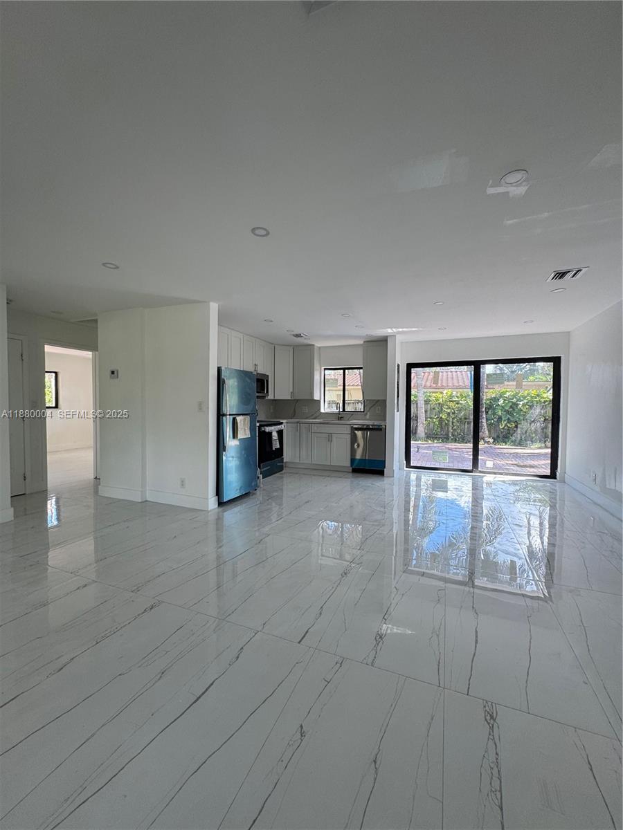 3030 Arthur Street Hollywood, FL 33021 - Photo 5 of 9 a view of empty room with furniture and floor to ceiling window