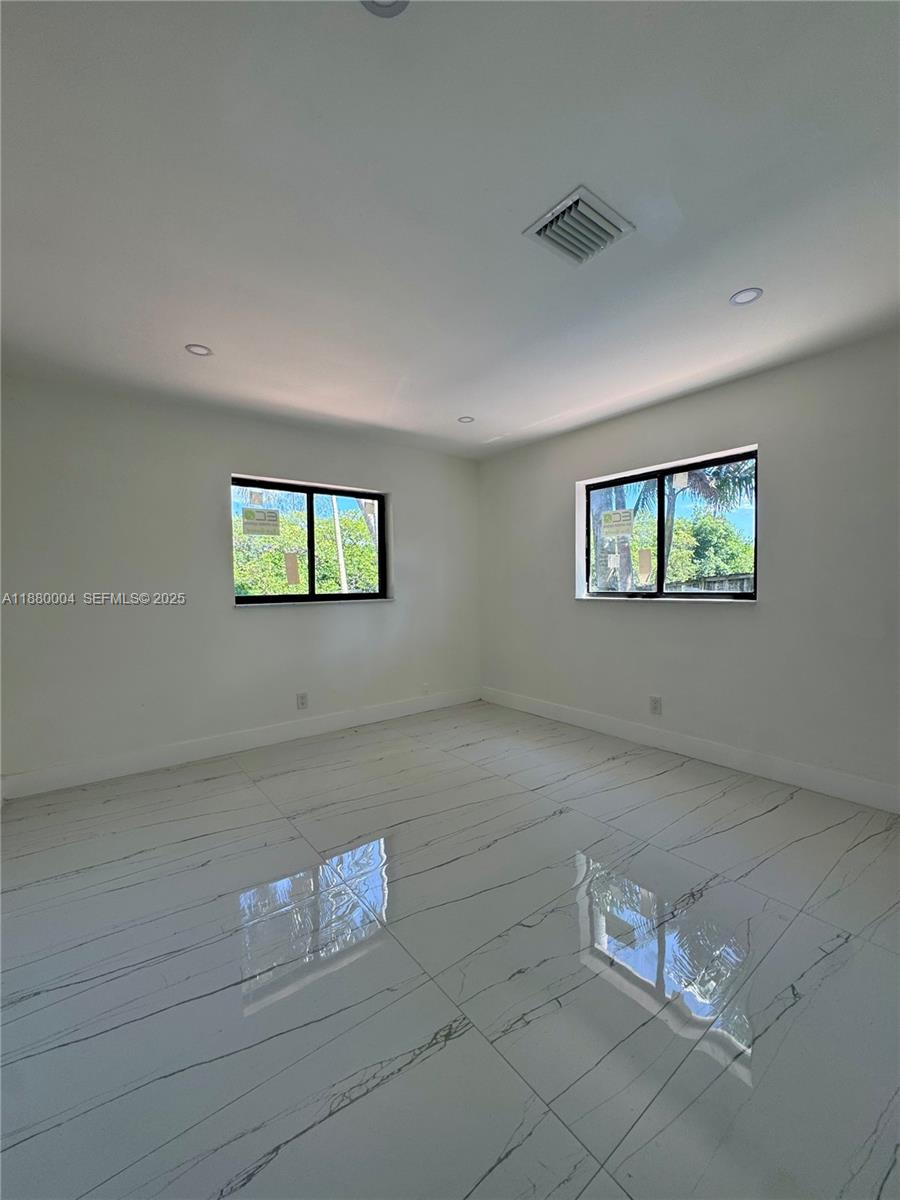 3030 Arthur Street Hollywood, FL 33021 - Photo 7 of 9 a view of a livingroom with windows