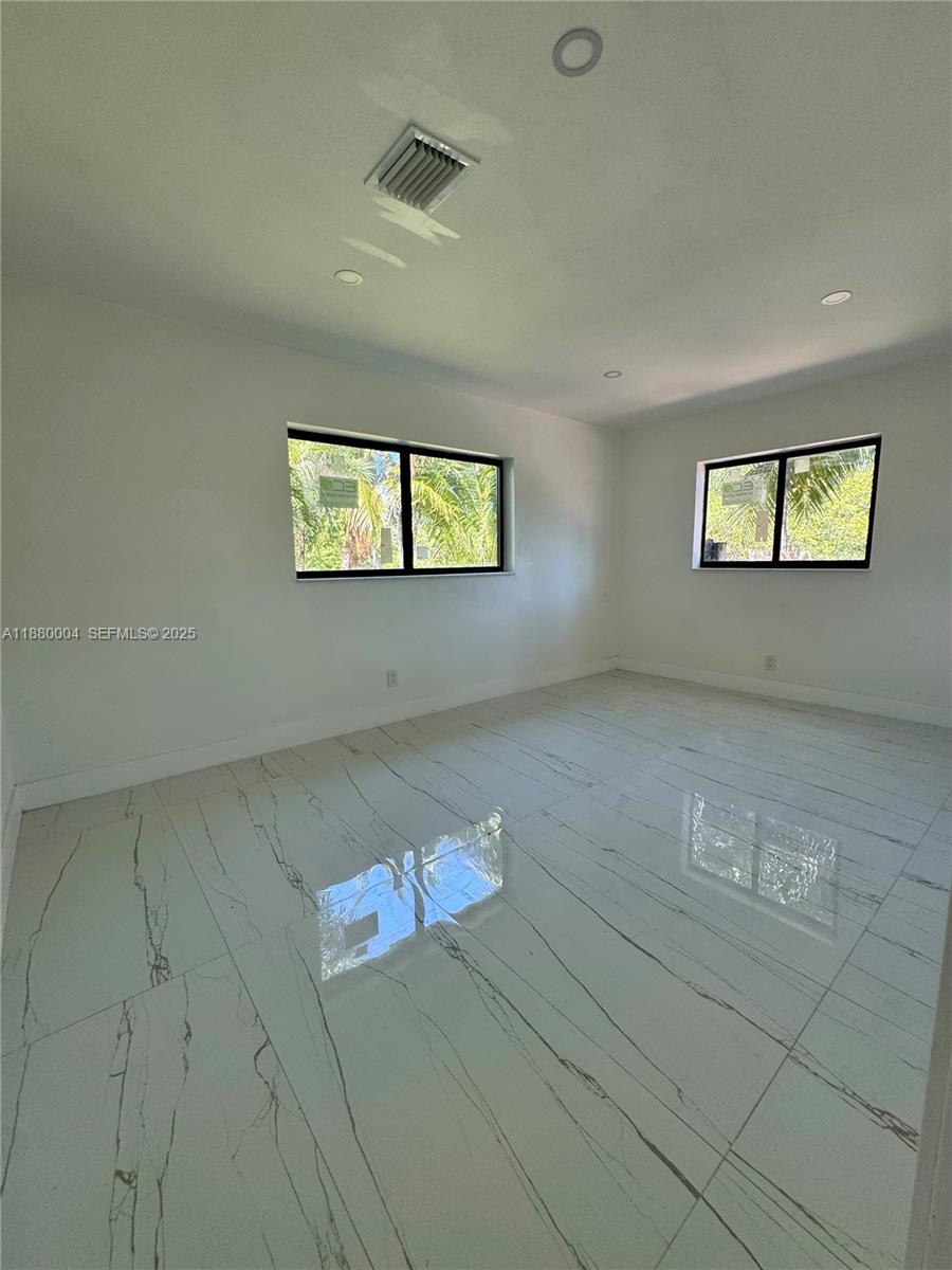 3030 Arthur Street Hollywood, FL 33021 - Photo 8 of 9 en empty room with windows