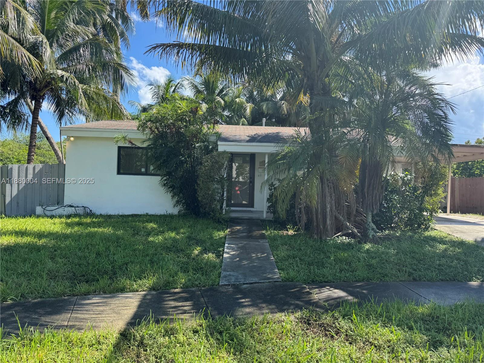 3030 Arthur Street Hollywood, FL 33021 - Photo 9 of 9 a front view of a house with garden
