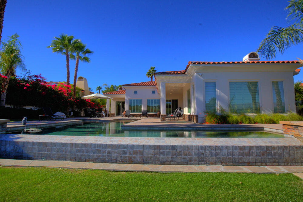 336 Loch Lomond Road Rancho Mirage, CA 92270 - Photo 1 of 26 a front view of house with yard and outdoor seating