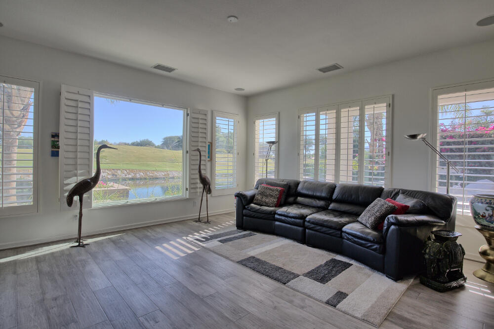 336 Loch Lomond Road Rancho Mirage, CA 92270 - Photo 14 of 26 a living room with furniture and a large window