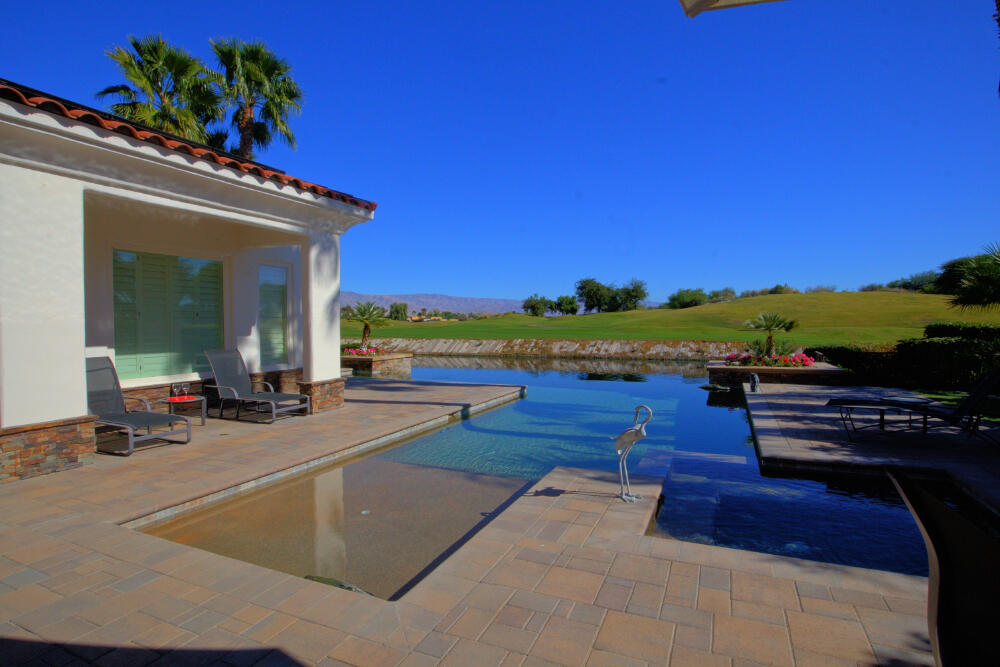 336 Loch Lomond Road Rancho Mirage, CA 92270 - Photo 3 of 26 a view of a patio with chairs and a table