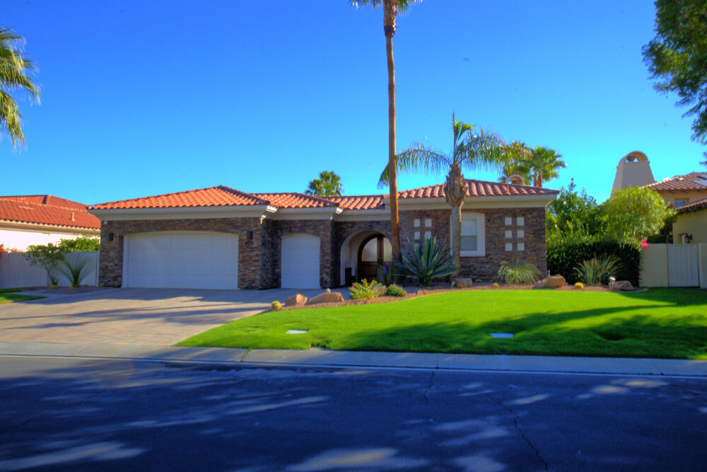 336 Loch Lomond Road Rancho Mirage, CA 92270 - Photo 4 of 26 a view of a house with a yard
