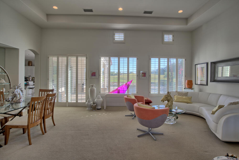 336 Loch Lomond Road Rancho Mirage, CA 92270 - Photo 6 of 26 a living room with furniture and a floor to ceiling window