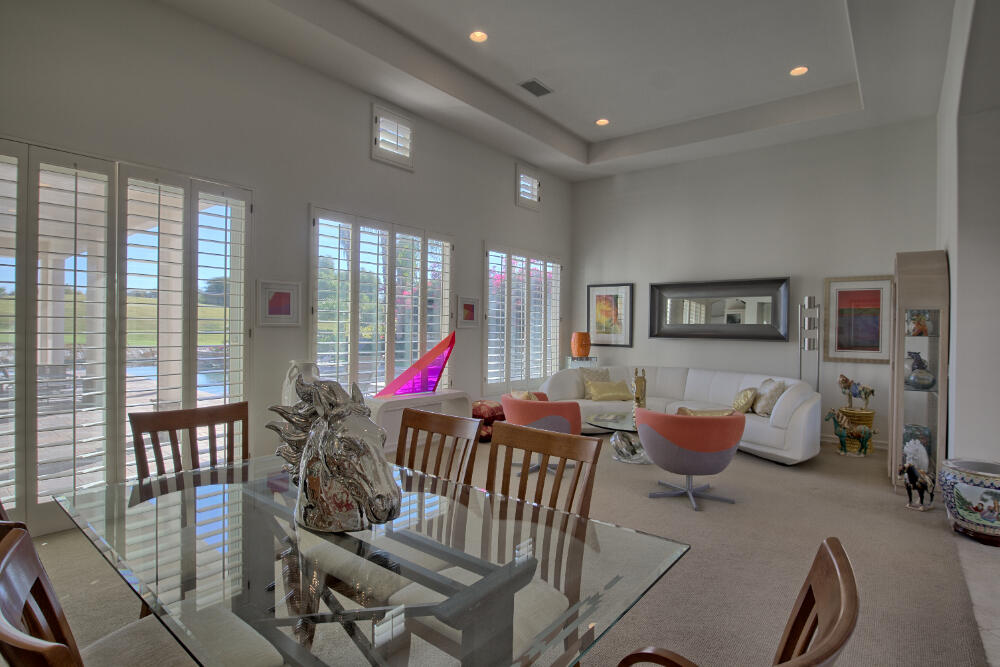 336 Loch Lomond Road Rancho Mirage, CA 92270 - Photo 9 of 26 a living room with furniture and a large window