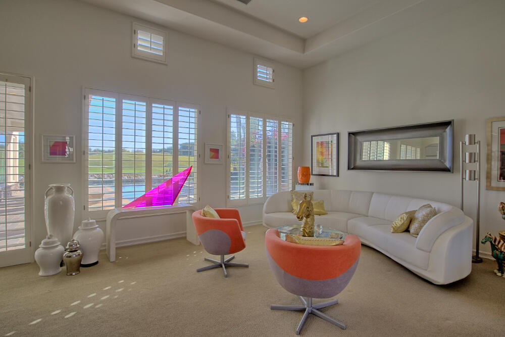 336 Loch Lomond Road Rancho Mirage, CA 92270 - Photo 10 of 26 a living room with furniture and a potted plant
