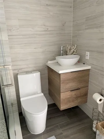 a bathroom with a toilet and a sink