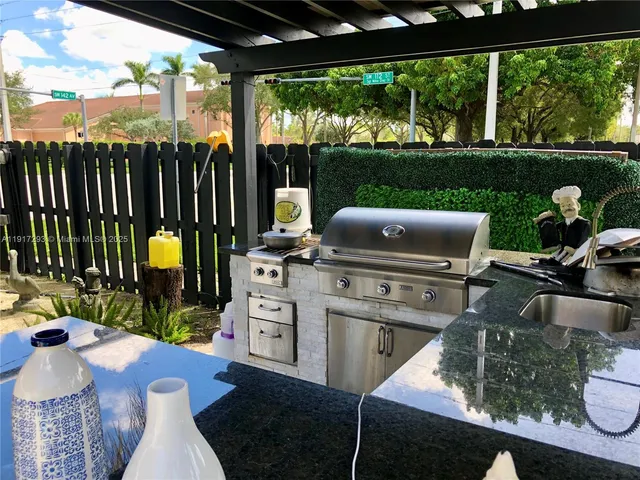 a view of a patio with couches chairs dining table and chairs