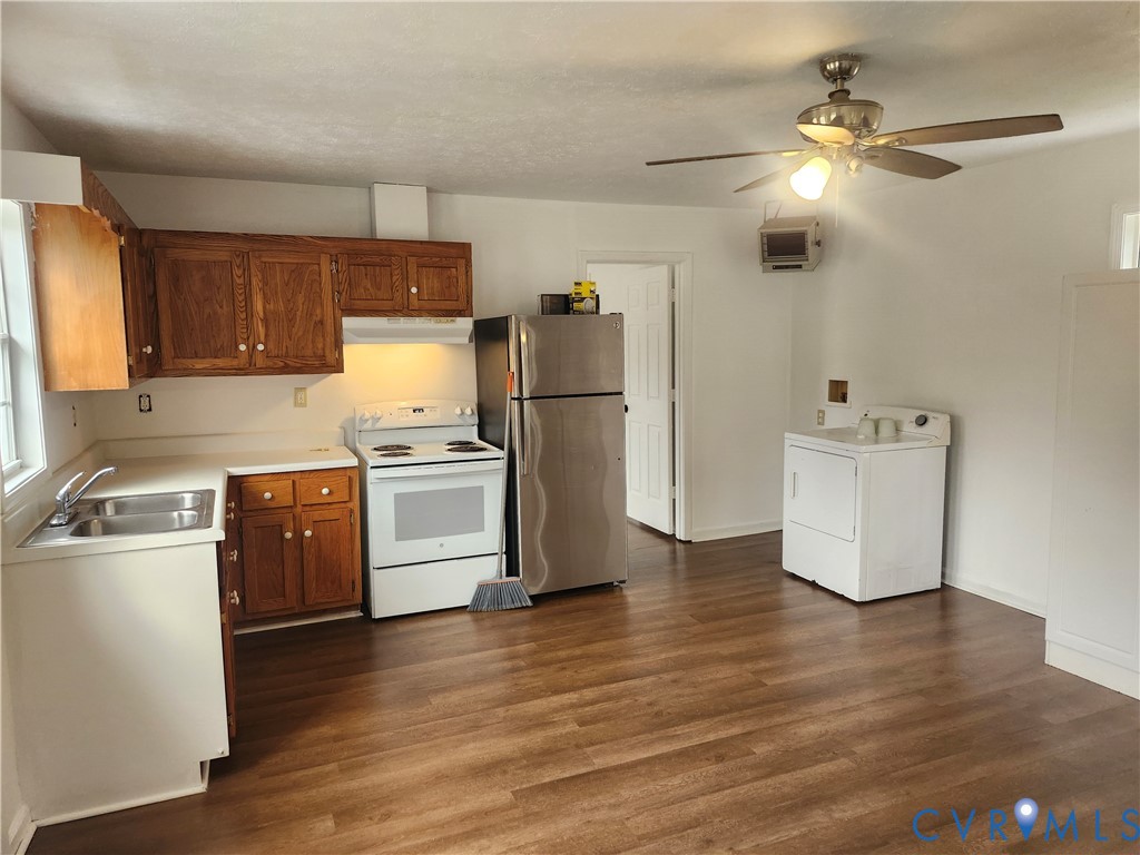 331 Stoney Point Road Cumberland, VA 23040 - Photo 5 of 10 a kitchen with a refrigerator cabinets and wooden floor