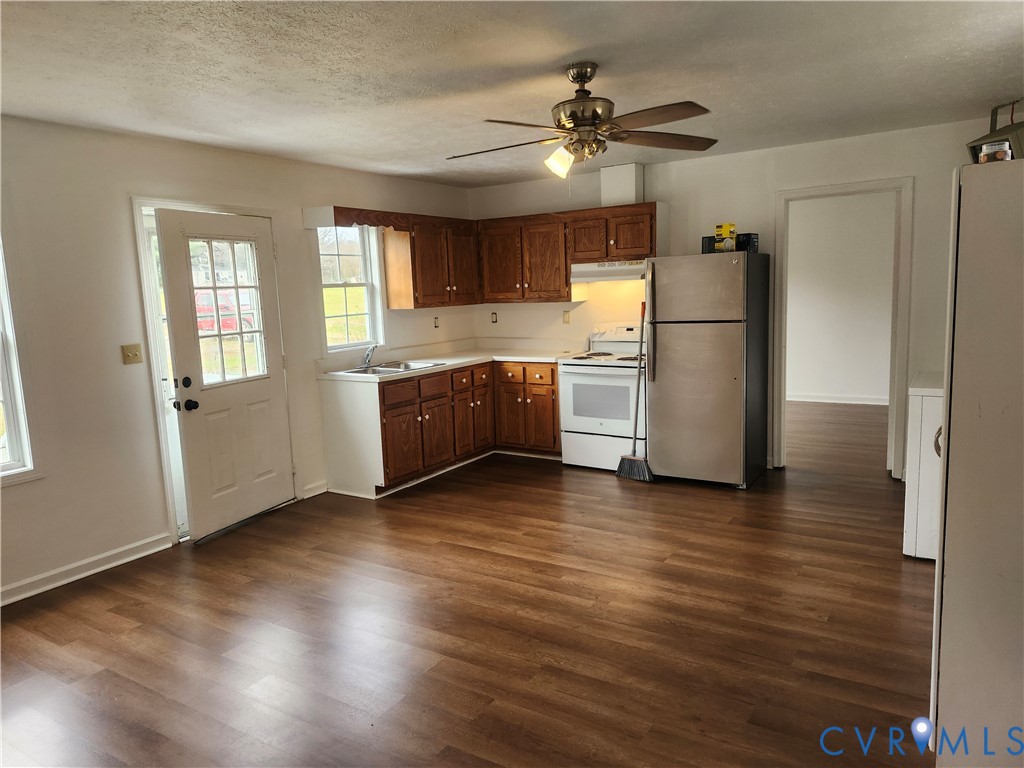 331 Stoney Point Road Cumberland, VA 23040 - Photo 6 of 10 a view of a kitchen with a sink a refrigerator and windows