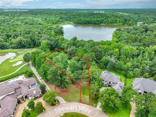 an aerial view of a house with a yard lake lake view and mountain view