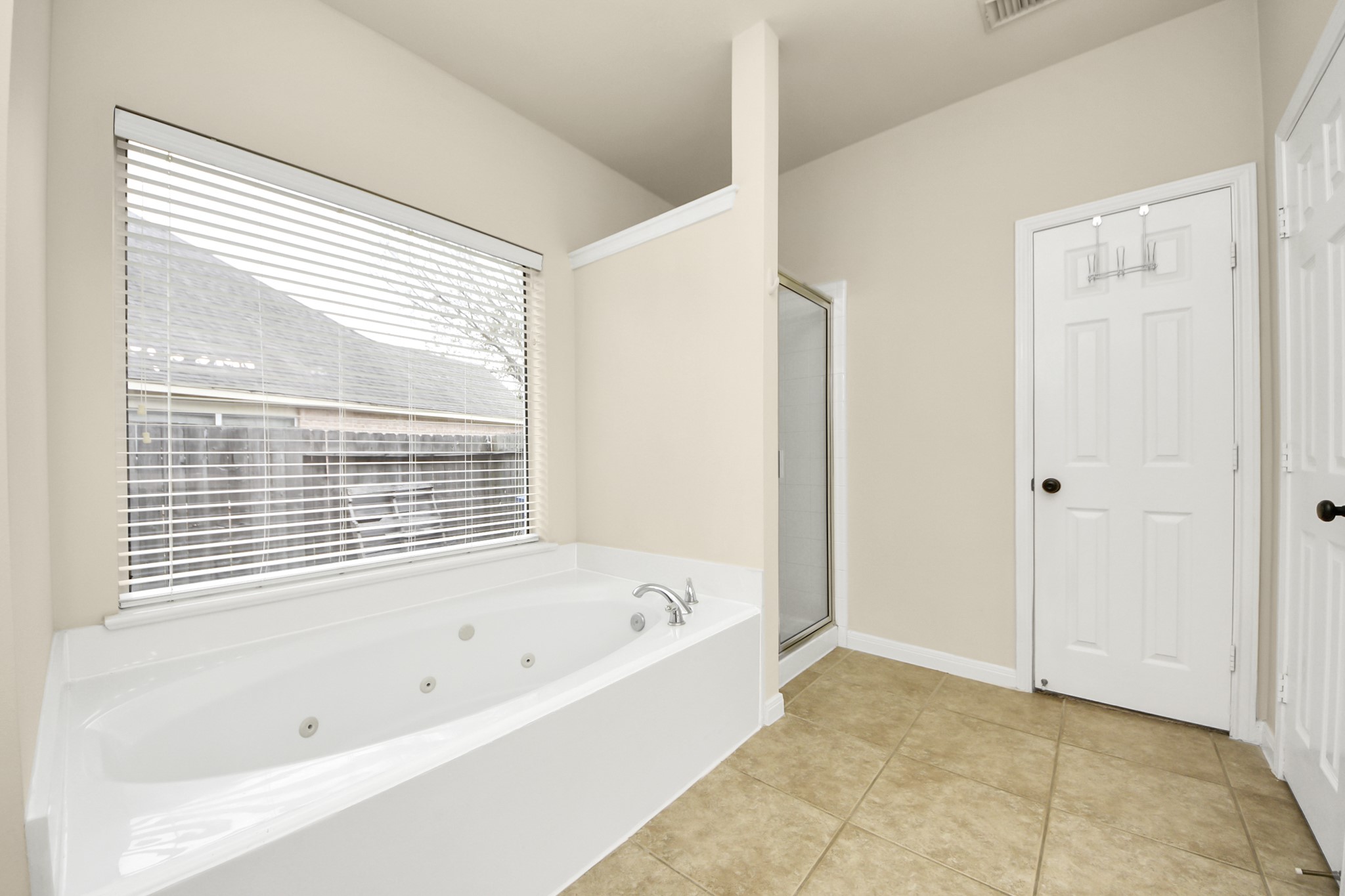 28306 Peper Hollow Lane Spring, TX 77386 - Photo 26 of 39 a bathroom with a bathtub and a shower