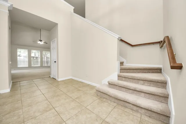 a view of an entryway with wooden floor and door