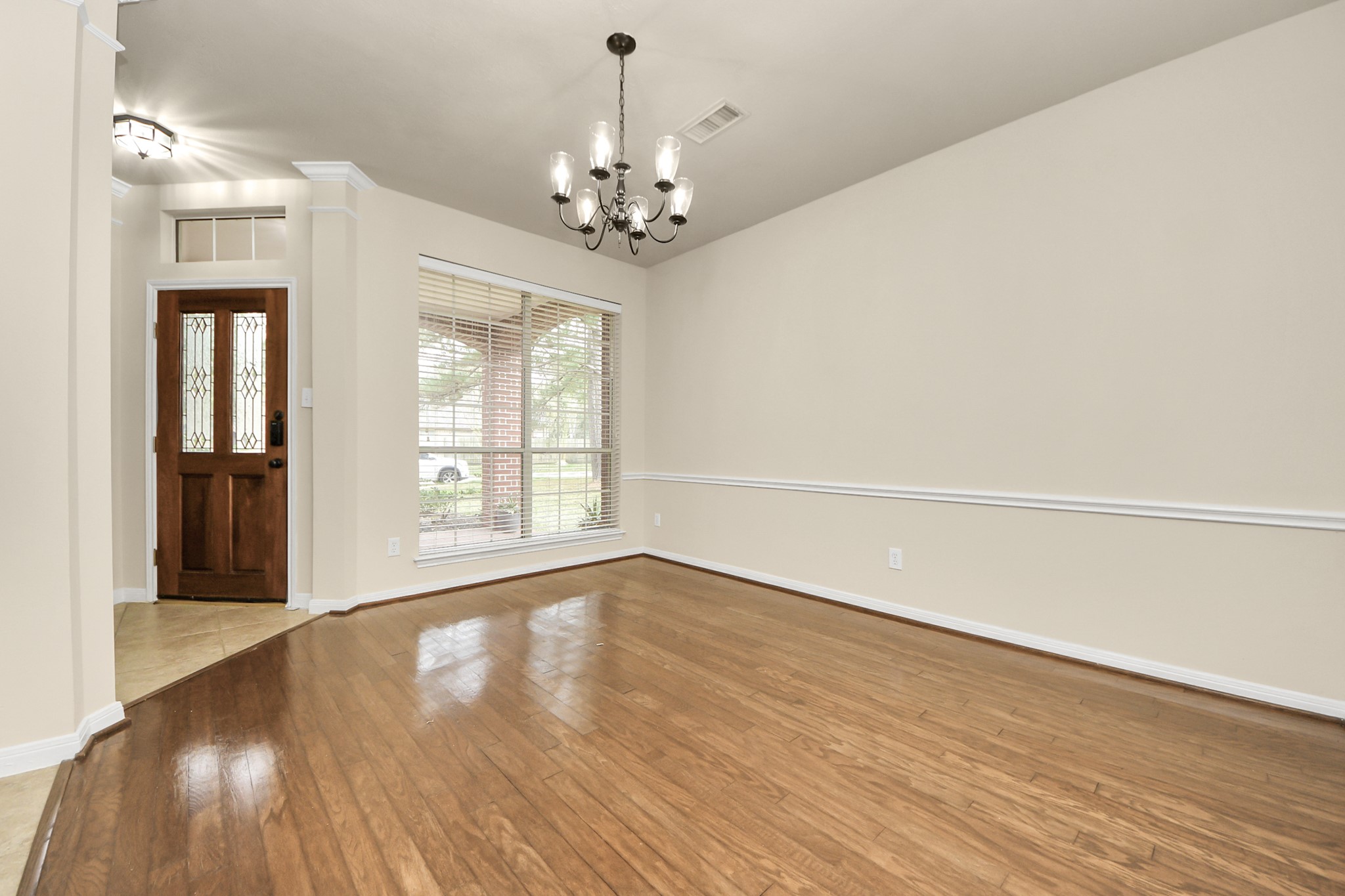 28306 Peper Hollow Lane Spring, TX 77386 - Photo 10 of 39 a view of an empty room with wooden floor and a window