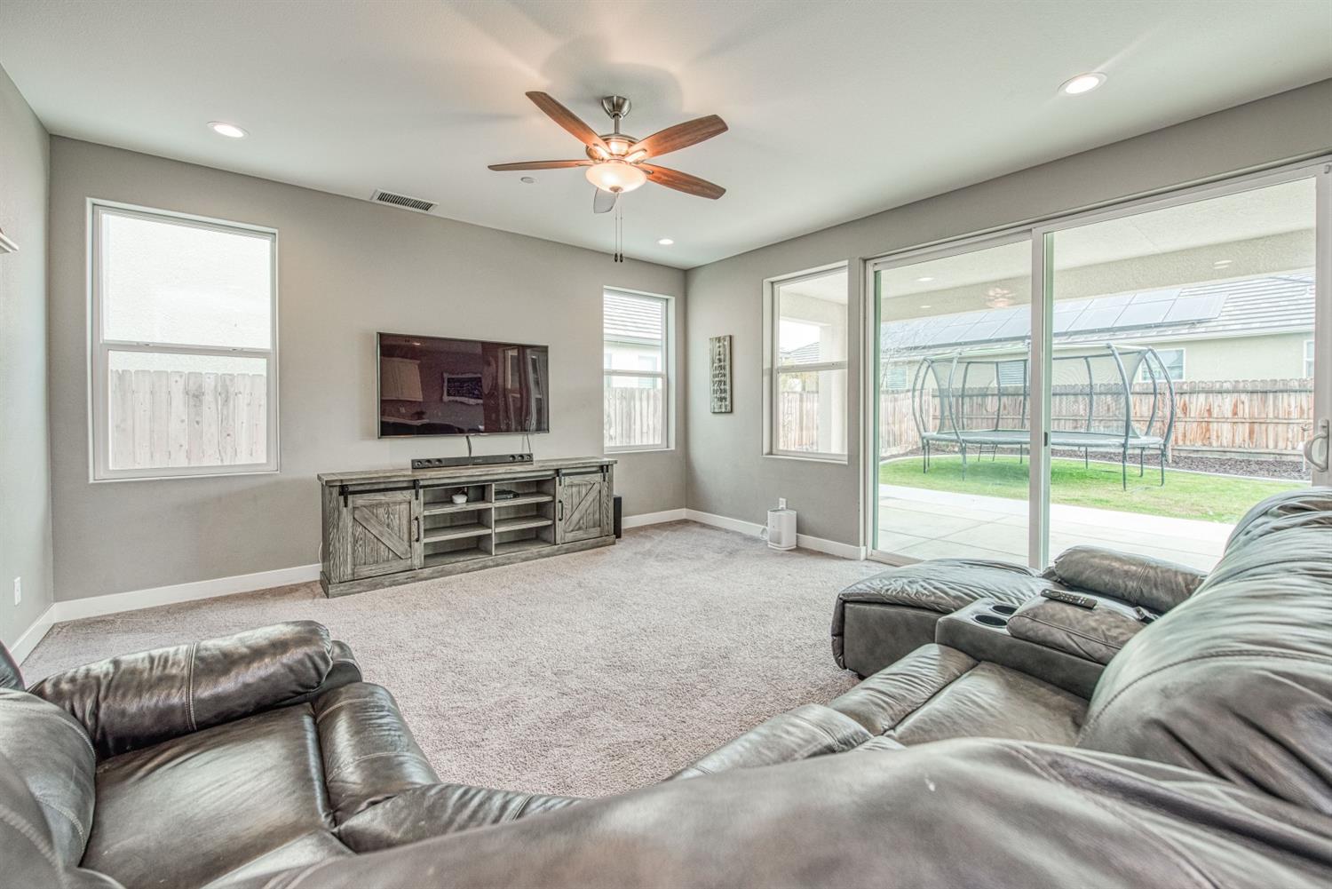 333 Meridian Avenue Madera, CA 93636 - Photo 11 of 38 a living room with furniture and a flat screen tv