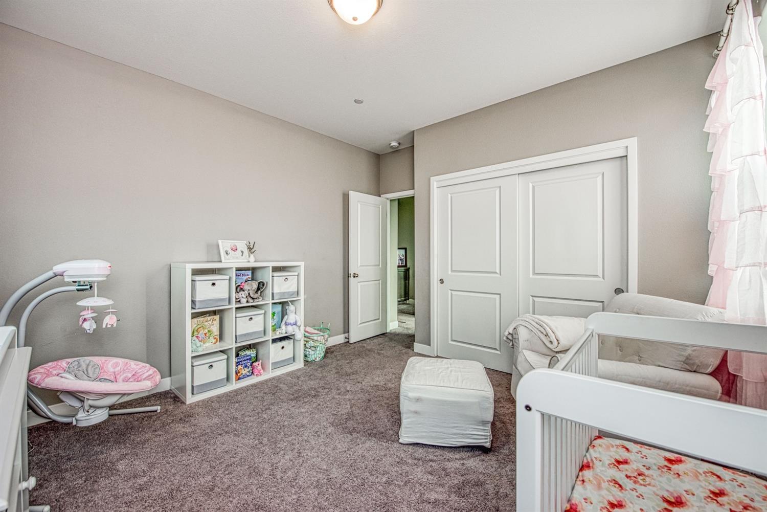 333 Meridian Avenue Madera, CA 93636 - Photo 22 of 38 a living room with furniture and a book shelf