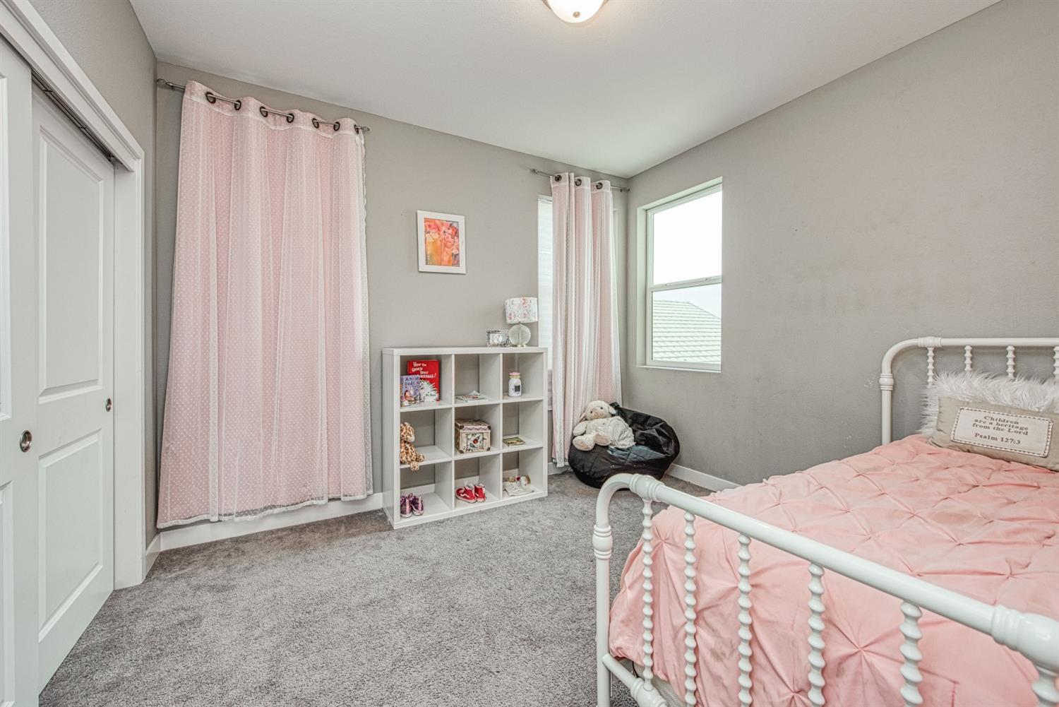 333 Meridian Avenue Madera, CA 93636 - Photo 24 of 38 a bedroom with a bed and a window