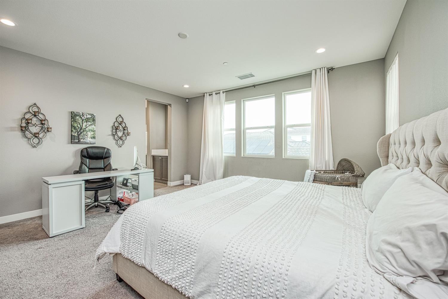 333 Meridian Avenue Madera, CA 93636 - Photo 31 of 38 a bedroom with a large bed and a window