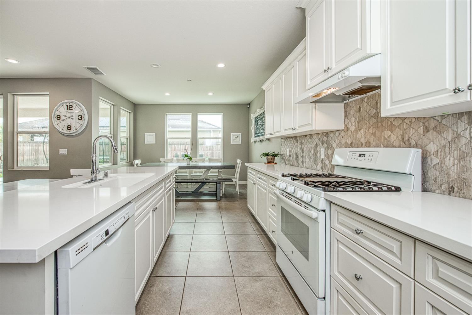333 Meridian Avenue Madera, CA 93636 - Photo 4 of 38 a kitchen with a stove oven and sink