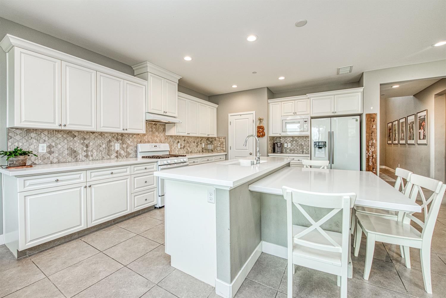 333 Meridian Avenue Madera, CA 93636 - Photo 7 of 38 a kitchen with appliances a sink and cabinets