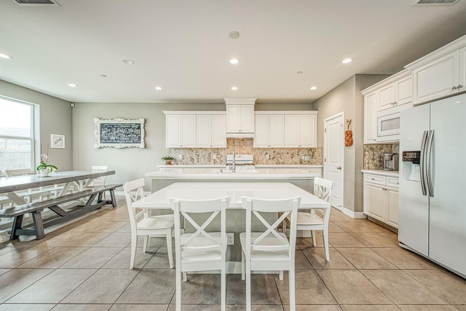 333 Meridian Avenue Madera, CA 93636 - Photo 9 of 38 a kitchen with kitchen island and stainless steel appliances
