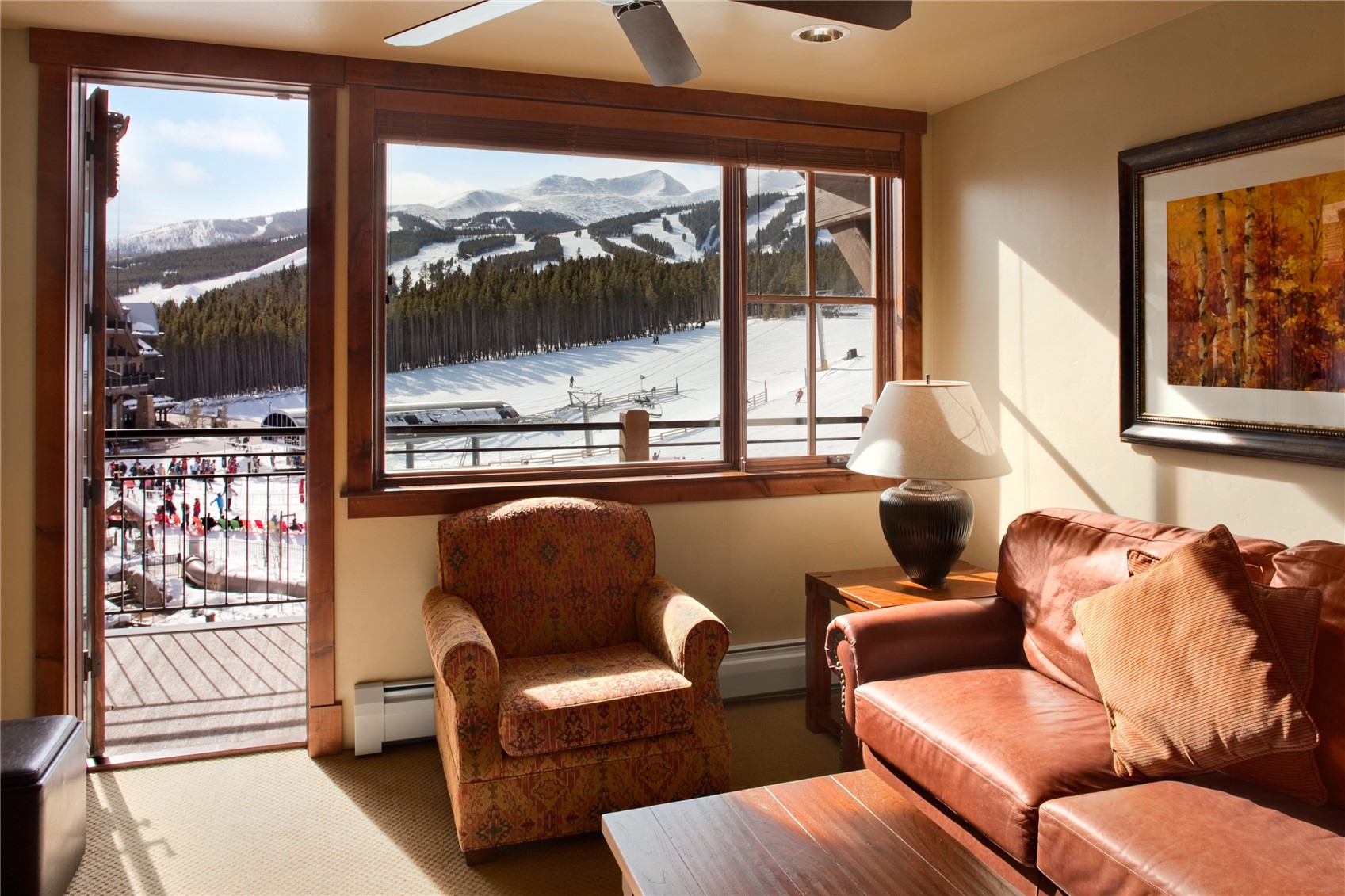 1979 Ski Hill Road, Unit COLORADO Breckenridge, CO 80424 - Photo 6 of 15 Living area with a mountain view, ceiling fan, healthy amount of natural light, and carpet flooring