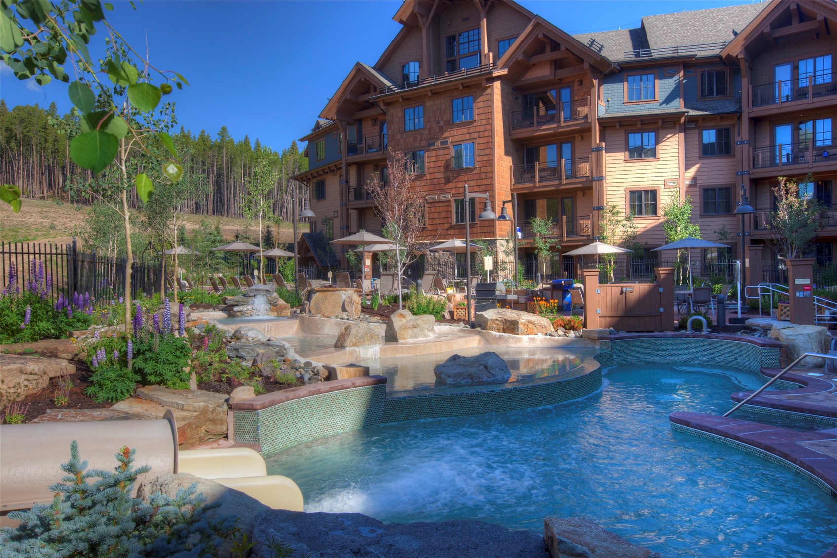 1979 Ski Hill Road, Unit COLORADO Breckenridge, CO 80424 - Photo 10 of 15 View of swimming pool with area for grilling and a hot tub