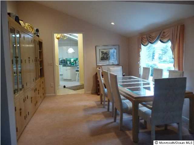 38 Tindall Road Middletown, NJ 07748 - Photo 3 of 3 a view of a dining room with furniture and a window