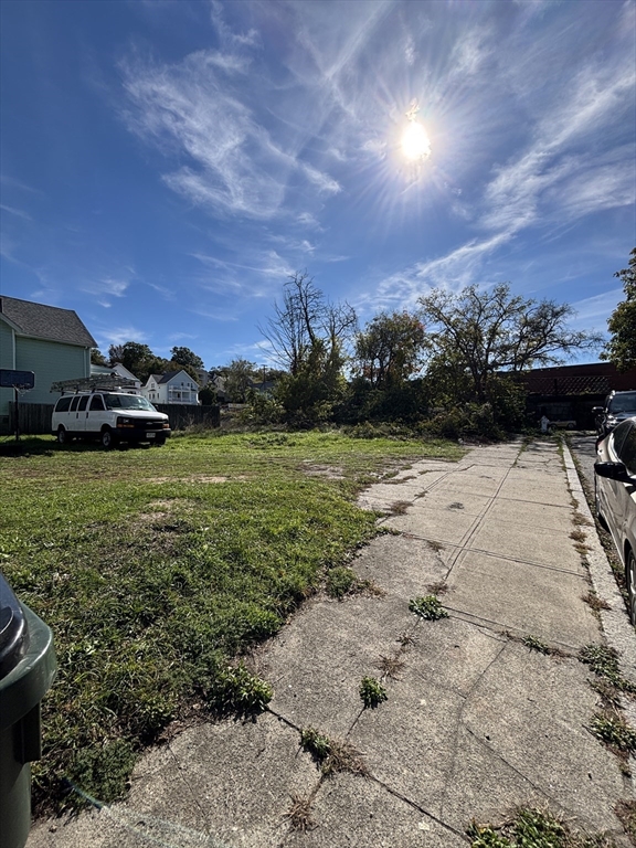 a view of a lake with a yard