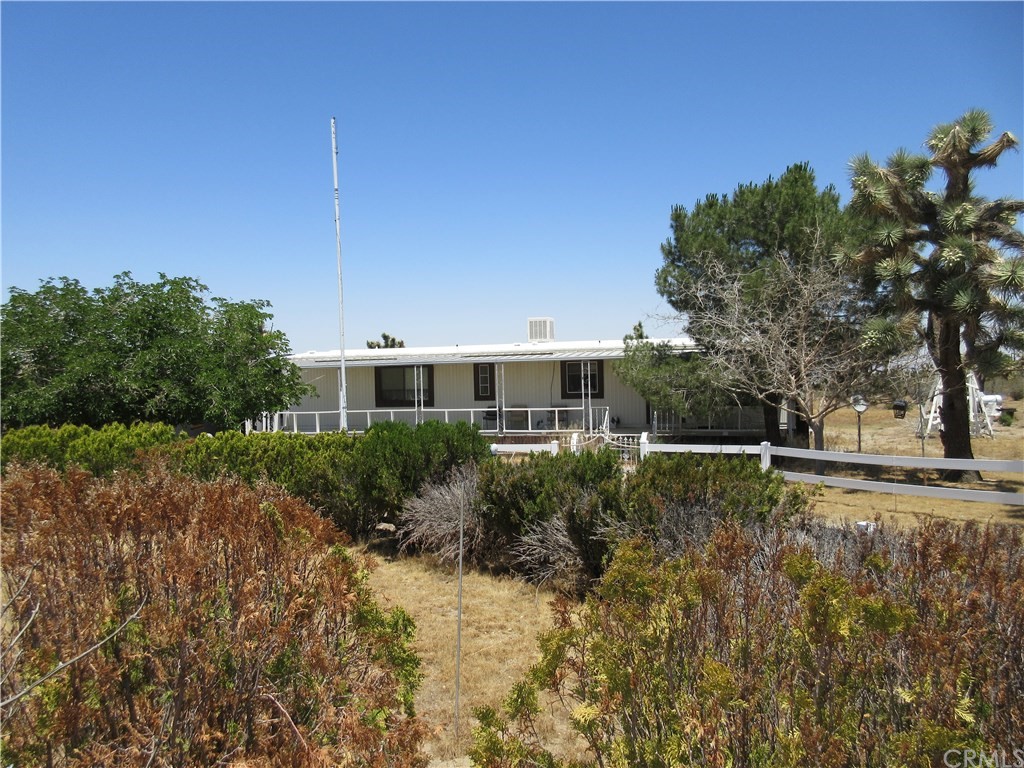2876 Marco Road Pinon Hills, CA 92371 - Photo 1 of 1 a front view of a house with a yard