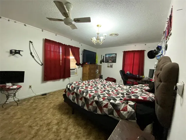 a bedroom with bed and window