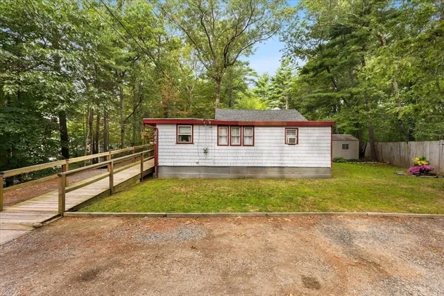 a front view of a house with a yard and a garage