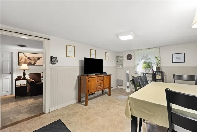 a view of a dining room with furniture and window