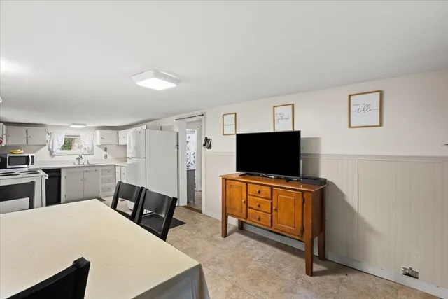 a bathroom with a sink mirror vanity and toilet