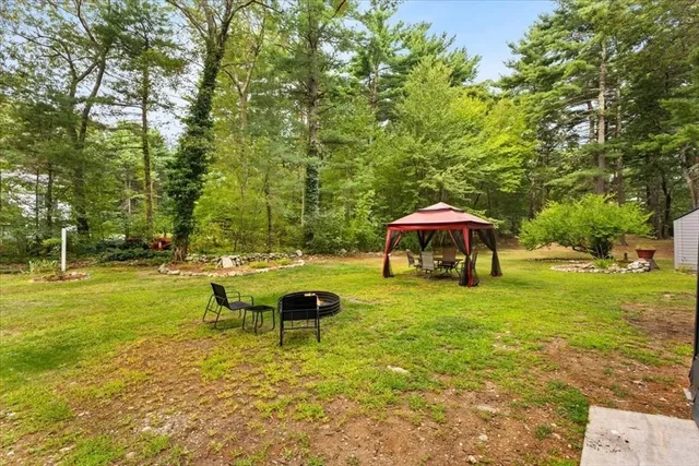 a view of a house with backyard porch and sitting area