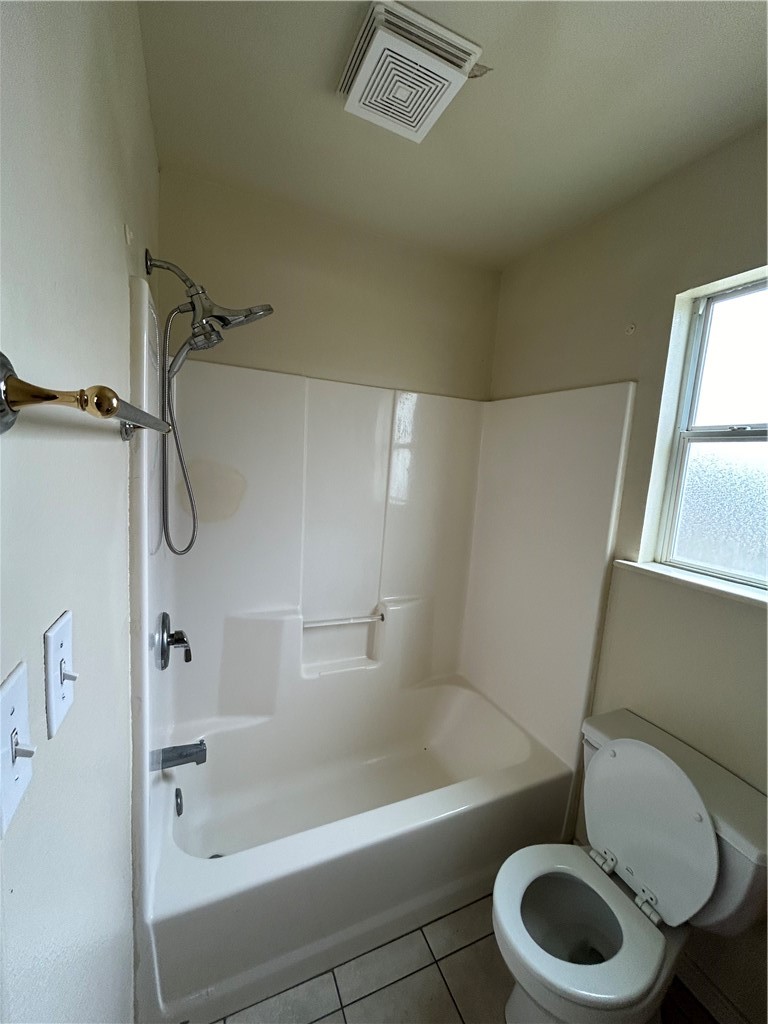 1401 Dewitt Street Corpus Christi, TX 78418 - Photo 5 of 11 a bathroom with a toilet bathtub and shower