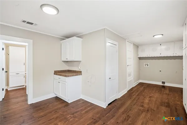 a kitchen with granite countertop a stove and a refrigerator