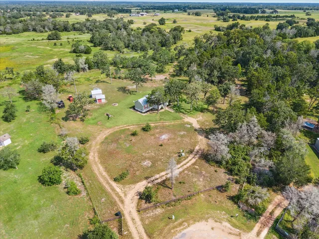 a view of a swimming pool with a yard