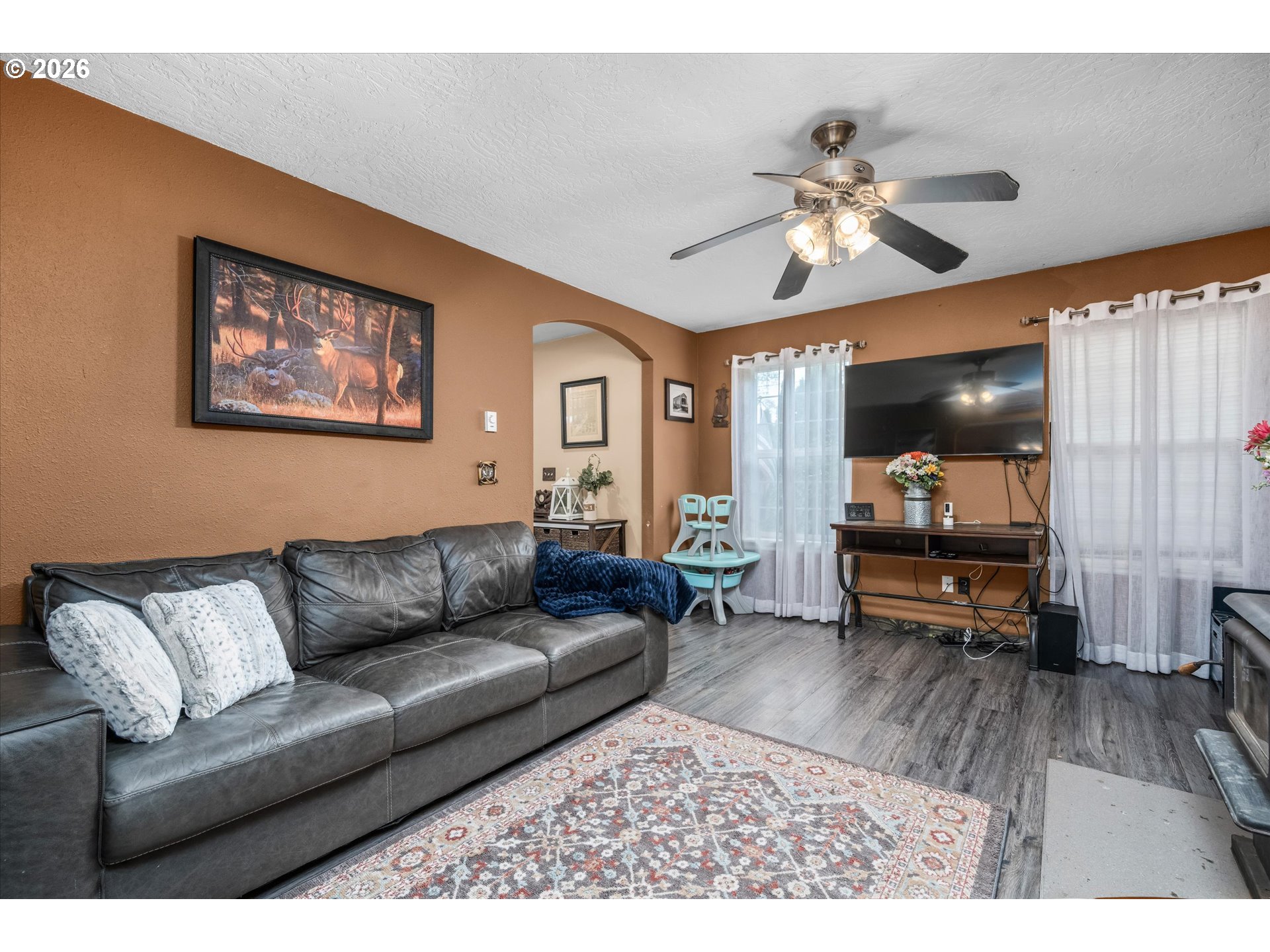 91051 Leashore Drive Vida, OR 97488 - Photo 10 of 36 a living room with furniture and a flat screen tv