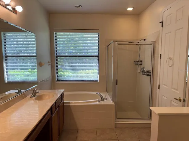 a bathroom with a sink double vanity and a mirror