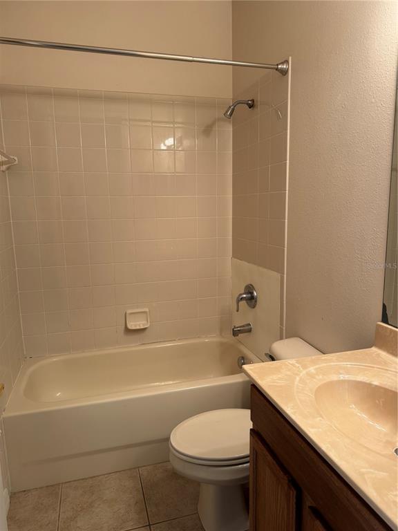 8237 Dunham Station Drive Tampa, FL 33647 - Photo 23 of 33 a bathroom with a sink a toilet and shower