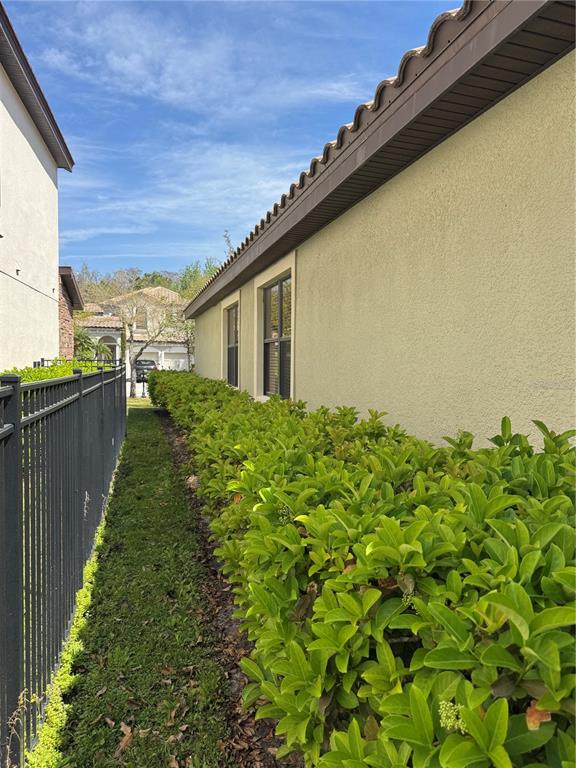 8237 Dunham Station Drive Tampa, FL 33647 - Photo 27 of 33 a backyard of a house with lots of green space